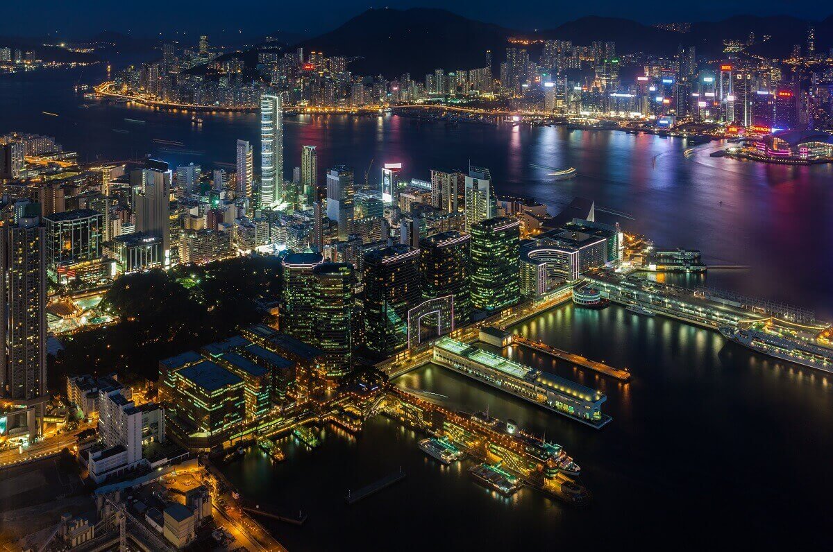 Aerial view of Hong Kong city and port at night.