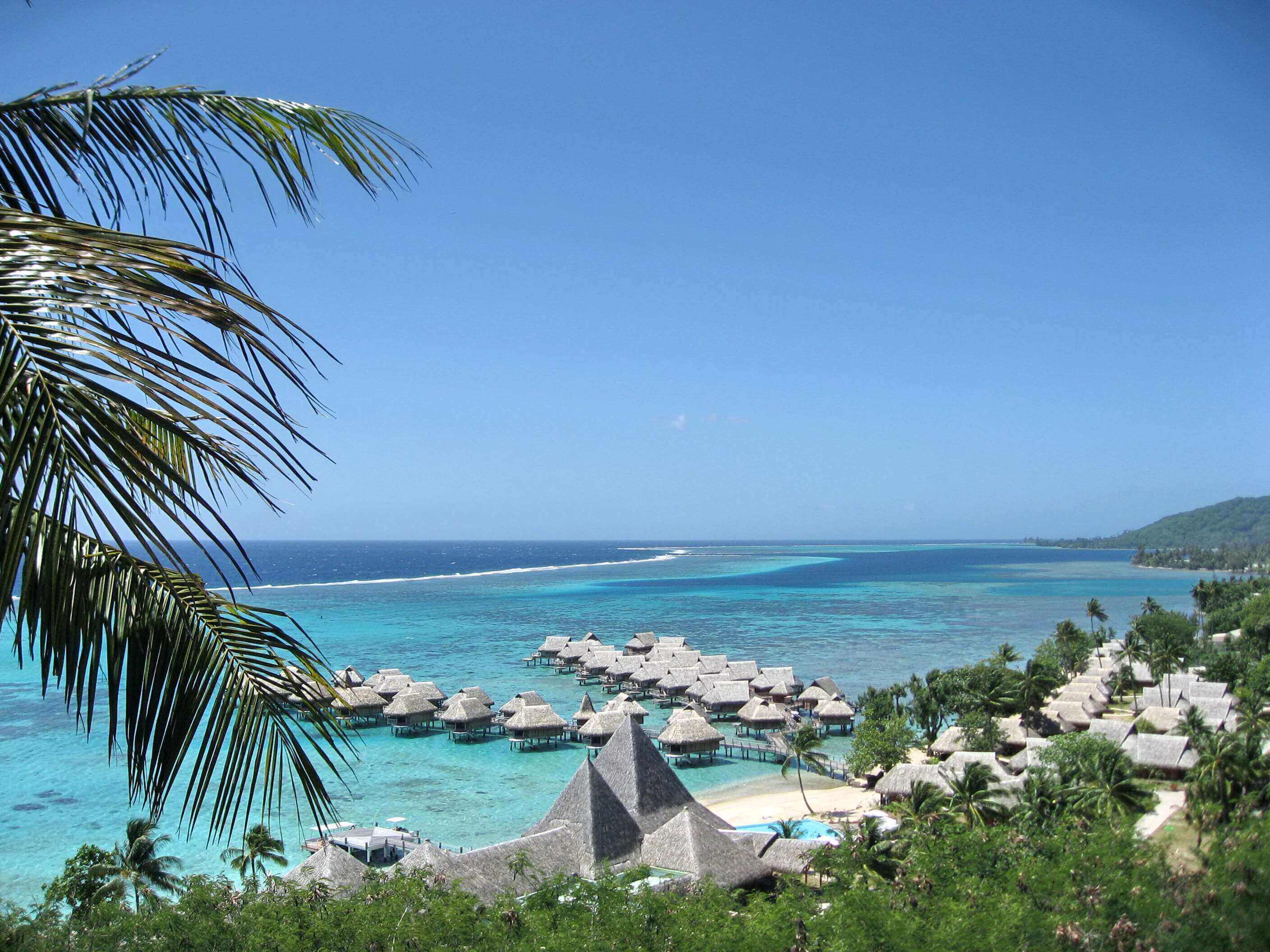 Beach bungalows on the beach in Tahiti, French Polynesia.